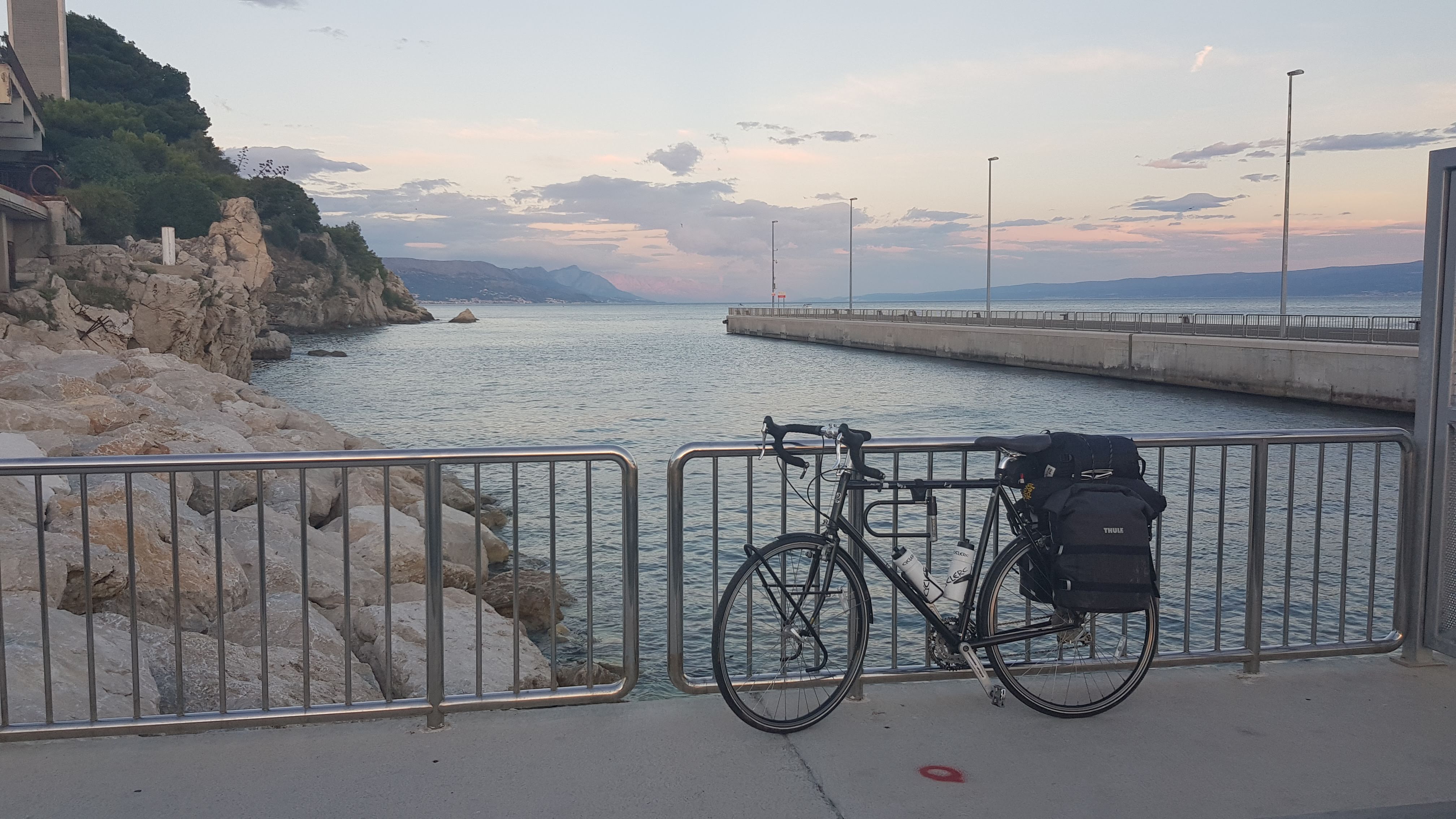 Touring bike by the Adriatic Sea at sunset